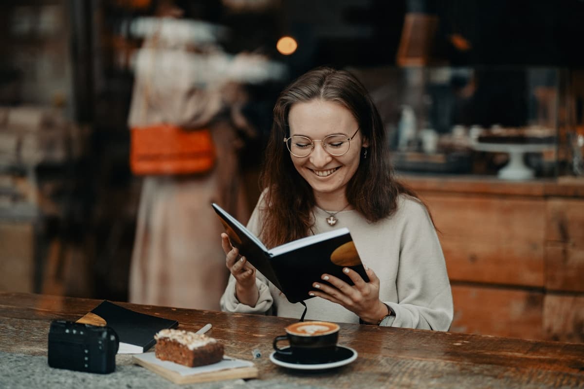 A teacher reading at a cafe
